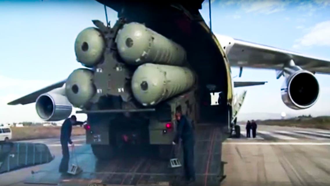 This photo made from the footage taken from Russian Defense Ministry official web site on Friday, Nov. 27, 2015, shows a Russian S-400 air defense missile systems being unloaded from an An-124 Ruslan cargo plane at the Hemeimeem air base in Syria, about 50 kilometers (30 miles) south of the border with Turkey. Russia’s President Vladimir Putin has ordered the deployment of the S-400s to the Russian base in Syria to help protect Russian warplanes after Turkey downed a Russian military jet at the border with Syria on Tuesday. (Russian Defense Ministry Press Service pool photo via AP)