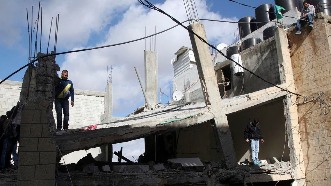 Palestinians inspect the house of Ibrahim Al-Akri after it was demolished by Israeli authorities. (File photo: AP)