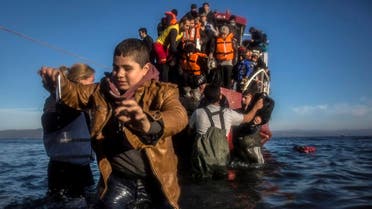 Refugees, mostly from Syria and Iraq, disembark a vessel on the Greek island of Lesbos after setting sail from Turkey. (AP Photo)