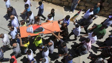 Mourners carry the body of 18-month-old Palestinian baby Ali Dawabsheh, who was killed after his family's house was set to fire in a suspected attack by Jewish extremists in Duma village near the West Bank city of Nablus. (File photo: Reuters)