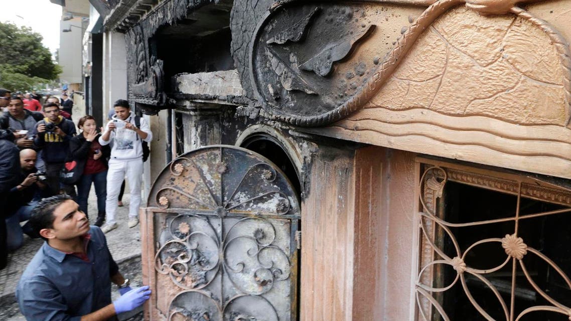 An Egyptian forensic member checks the entrance of a nightclub which was attacked in Cairo. (AP)