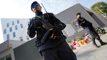 Thai police officers stand guard outside French Embassy in Bangkok, Thailand. (AP)