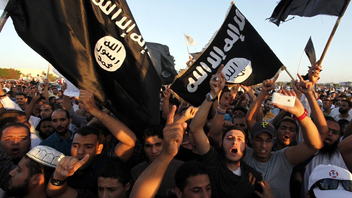 Libyan followers of Ansar al-Shariah Brigades and other Islamic militias, hold a demonstration against a film and a cartoon denigrating the Prophet Muhammad in Benghazi, Libya, Friday, Sept. 21, 2012. The attack that killed the U.S. ambassador and three other Americans has sparked a backlash among frustrated Libyans against the heavily armed gunmen, including Islamic extremists, who run rampant in their cities. more than 10,000 people poured into a main boulevard of Benghazi, demanding that militias disband as the public tries to do what Libya's weak central government has been unable to.(AP