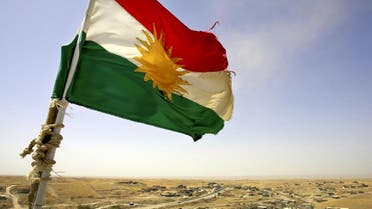 A Kurdish flag waves from the top of a new watertower built by the Patriotic Union of Kurdistan political party Monday, Aug. 15, 2005 in the village of Shwan, outside Kirkuk, Iraq. Since 2003, there has been a steady influx of Kurdish returnees to the area around Kirkuk leading to the rebirth of villages such as Shwan, reversing Saddam Hussein's decades long policy of Arabization. (AP Photo/Jacob Silberberg)