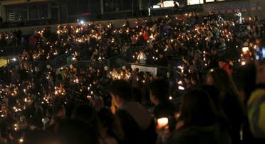 Attendees reflect on the tragedy of Wednesday's attack during a candlelight vigil in San Bernardino, California December 3, 2015. 