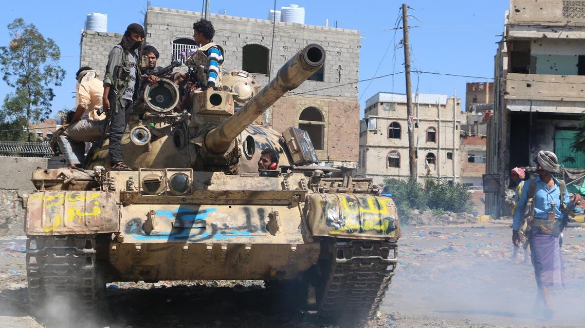 Tribal fighters prepare to take their positions on a street during fighting with Shiite rebels known as Houthis, in Taiz, Yemen, Monday, Nov. 16, 2015. (AP