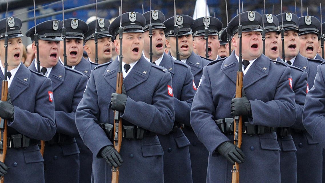 Polish Army soldiers salute during the Independence Day ceremonies marking the 97th anniversary of Poland's independence, in Warsaw, Poland, Wednesday, Nov. 11, 2015. (AP Photo/Alik Keplicz)