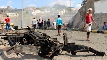 Yemenis inspect the scene of a car bomb attack that killed a Yemeni senior official in the southern port city of Aden, Yemen, Sunday, Dec. 6, 2015. (AP)