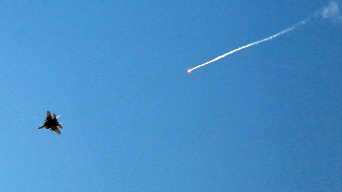 An Israeli fighter jet releases a flare as it flies over the Gaza Strip. (File photo: AP)