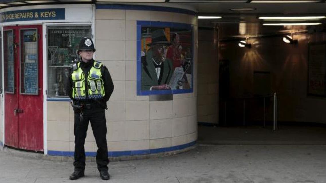 A police officer patrols outside Leytonstone Underground station in east London. (Reuters)