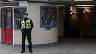 A police officer patrols outside Leytonstone Underground station in east London. (Reuters)