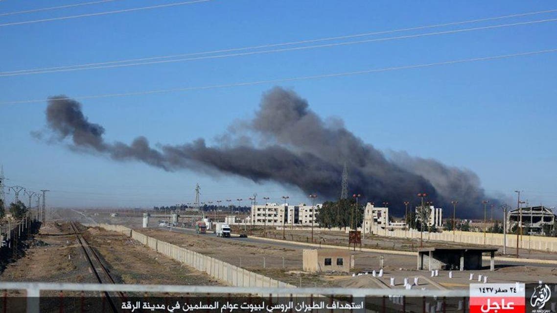 This image posted online Sunday, Dec. 6, 2015, by supporters of the Islamic State militant group on an anonymous photo sharing website, shows smoke rising in the aftermath of an airstrike that targeted areas in Raqqa, Syria. The photo bears the watermark of Islamic State media releases and is consistent with other AP reporting. The Arabic caption on the photo reads, "Russian warplanes target homes of Muslims in Raqqa.” (militant photo via AP)
