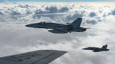 Royal Canadian Air Force CF-18 Hornets depart after refueling with a KC-135 Stratotanker assigned to the 340th Expeditionary Air Refueling Squadron over Iraq October 30, 2014. (Reuters)