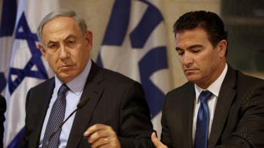 A picture taken at the Israeli foreign ministry on October 15, 2015, shows Prime Minister Benjamin Netanyahu (L) sitting next to newly appointed Mossad chief Yossi Cohen. (AFP)