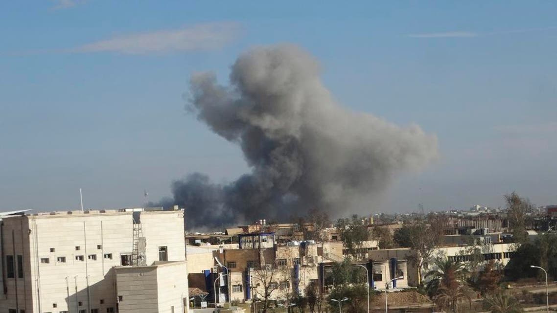 Smoke rises from Islamic State positions following a U.S.-led coalition airstrike in Ramadi, the capital of Iraq's Anbar province, 70 miles (115 kilometers) west of Baghdad, Iraq, Wednesday, Dec. 2, 2015. (AP Photo/Osama Sami)