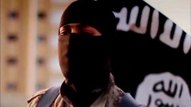 A masked man speaking in what is believed to be a North American accent in a video that ISIS released in September 2014 is pictured in this still frame from video obtained by Reuters October 7, 2014. (Reuters)