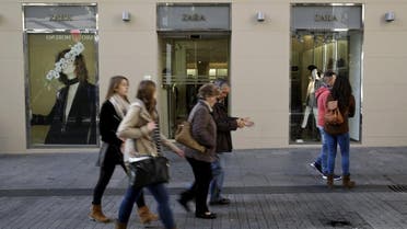 People walk past a Zara store in central Madrid, Spain, December 9, 2015 (Reuters)