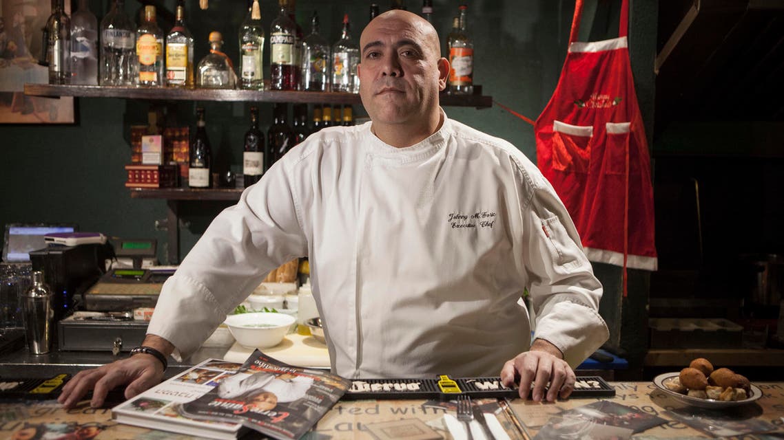 In this photo taken Tuesday, Dec. 8, 2015, Israeli Arab chef Johnny Goric poses during a Arab Food Festival in Haifa, Israel. AP