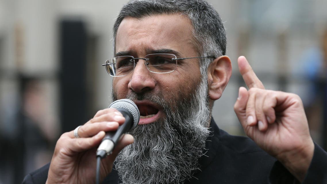 Anjem Choudary, right, a British Muslim social and political activist and spokesman for Islamist group, Islam4UK, speaks following prayers at the Central London Mosque in Regent's Park, London, Friday, April 3, 2015. (AP)