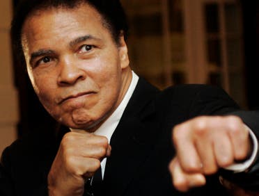 U.S. boxing great Muhammad Ali poses during the Crystal Award ceremony at the World Economic Forum (WEF) in Davos, Switzerland in this January 28, 2006 file photo. 