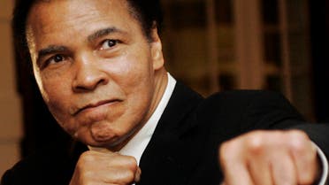 U.S. boxing great Muhammad Ali poses during the Crystal Award ceremony at the World Economic Forum (WEF) in Davos, Switzerland in this January 28, 2006 file photo. 