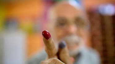 Egyptian voter Abdel Moneam Kandil, 80, shows his inked finger after he voted at a polling station of the runoff to the first round of the parliamentary elections in Egypt. (File photo: AP)