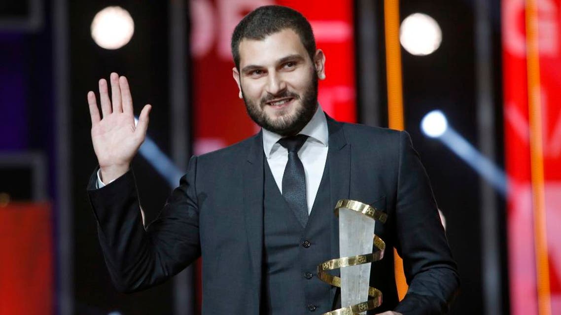 Director Mir-Jean Bou Chaaya poses for photographers after winning the Golden Star prize for the film " Very Big Shot " during the closing ceremony of the the 15th Marrakech International Film in Marrakech, Saturday, Dec. 12, 2015. (AP)