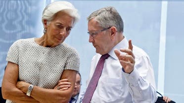 Managing Director of the International Monetary Fund Christine Lagarde, left, speaks with Chair of the European Financial Stability Facility Klaus Regling during a meeting of eurozone finance ministers. (File: AP)