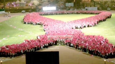 Wearing pink scarves, 10,000 Saudi women stood hand-in-hand in the football stadium at Princess Nourah Bint Abdulrahman University at the conclusion of a day-long fair to raise awareness about women’s health in Riyadh. (Photo: Saudi Gazette)