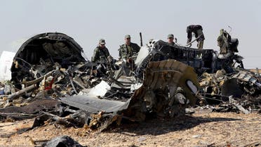 File photo shows Russian military investigators near the debris of a Russian airliner at the site of its crash at the Hassana area in Arish city, north Egypt. (Reuters)