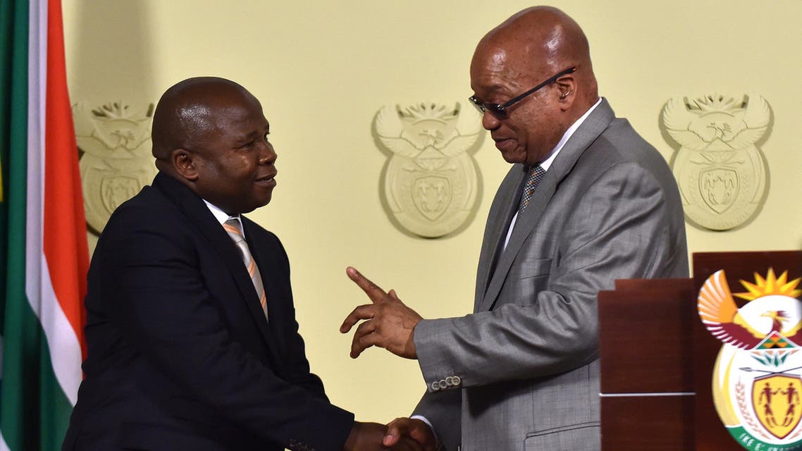 South African president Jacob Zuma, right, congratulates newly sworn-in Finance Minister David Van Rooyen, in Pretoria, South Africa, Thursday, Dec. 10, 2015.