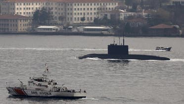 Russia's diesel-electric submarine Rostov-on-Don is escorted by a Turkish Navy Coast Guard boat as it sets sail in the Bosphorus, on its way to the Black Sea, in Istanbul, Turkey. (File: AP)