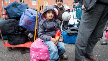 Two refugee children wait amongst luggage for registration at the Hesse state Initial Reception Center in Giessen, Germany, Wednesday Dec. 2, 2015. (AP)efugee children wait amongst luggage for registration at the Hesse state Initial Reception Center in Giessen, Germany, Wednesday Dec. 2, 2015. (AP)ren wait amongst luggage for registration at the Hesse state Initial Reception Center in Giessen, Germany, Wednesday Dec. 2, 2015. (AP)