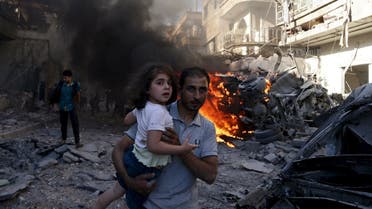 A man carries a girl as they rush away from a site hit by what activists said were airstrikes by forces loyal to Syria's President Bashar al-Assad in the Douma neighbourhood of Damascus, Syria August 24, 2015. (Reuters)