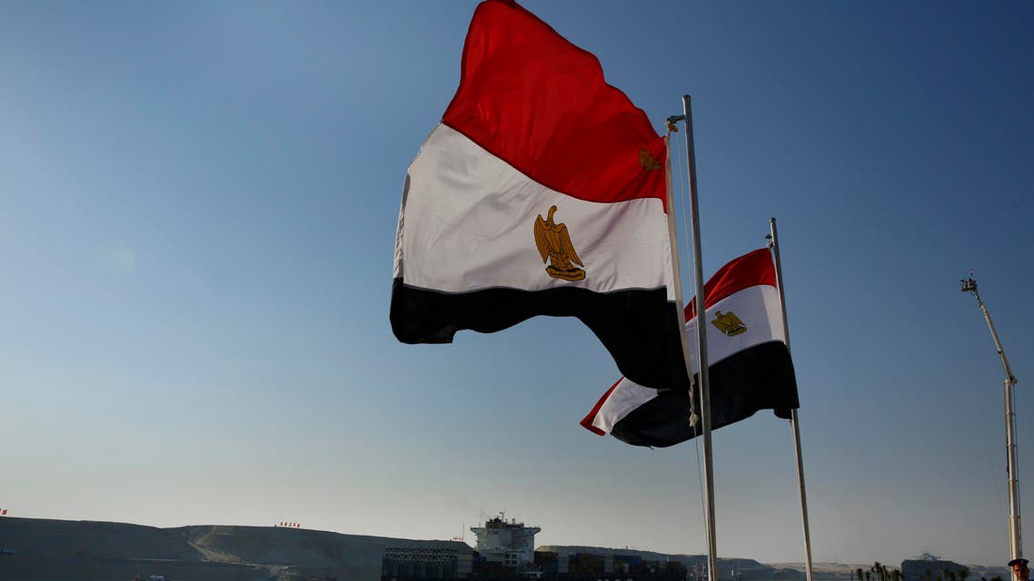 A cargo container ship crosses the new section of the Suez Canal after the opening ceremony in Ismailia, Egypt, Thursday, Aug. 6, 2015.