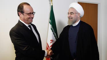 French President Francois Hollande (L) welcomes his Iranian counterpart Hassan Rouhani for a meeting during the 70th UN General Assembly on September 27, 2015, in New York