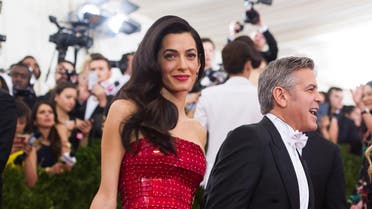 George Clooney and Amal Clooney arrive at The Metropolitan Museum of Art's Costume Institute benefit gala celebrating "China: Through the Looking Glass" on Monday, May 4, 2015, in New York.