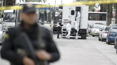 Tunisian forensics police inspect the scene of a suicide bomb attack in Tunis, Tunisia November 25, 2015.