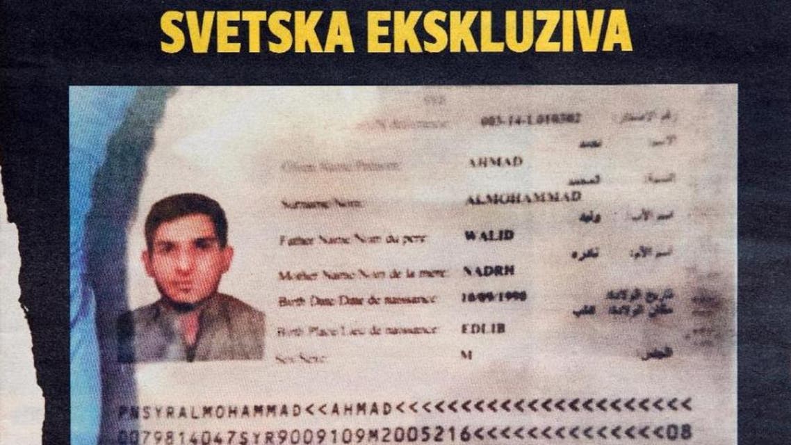 A photo taken in Belgrade on November 15, 2015 shows the front page of Serbian magazine Blic, displaying a Syrian passport issued to asylum seeker Ahmad alMohammad and found by police at the scene of one of the Paris attacks. (AFP)