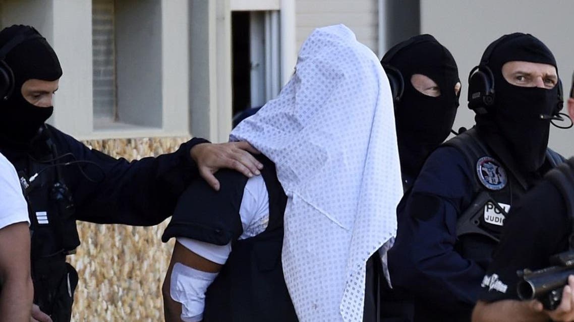 his file photo taken on June 28, 2015 shows French police escorting Yassin Salhi. (File photo: AFP)