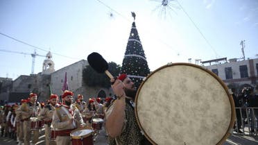 A Palestinian marching band parades during a Christmas procession at Manger Square in the West Bank town of Bethlehem December 24, 2015. (Reuters)