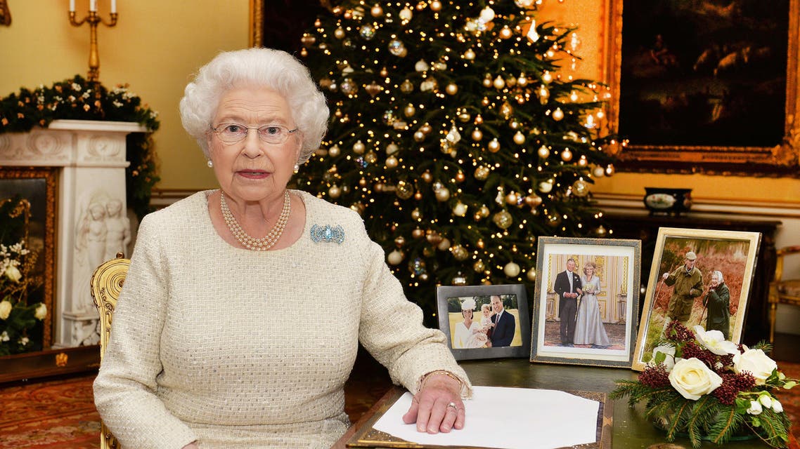In this Dec. 10, 2015 photo, Britain's Queen Elizabeth II sits at a desk in the 18th Century Room in Buckingham Palace in London, after recording her Christmas Day broadcast to the Commonwealth, to be broadcast Friday, Dec. 25, 2015.