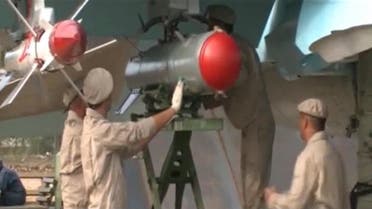A frame grab taken from footage released by Russia's Defence Ministry November 30, 2015, shows Russian military engineers working on an Su-34 fighter bomber at Hmeymim airbase in Syria. Russian Su-34 fighter bombers flew in Syria for the first time with air-to-air missiles for self-defence on Monday, a Russian air force official told Russian news agencies, less than a week after a Turkish F-16 shot down a Russian jet. Footage released November 30, 2015. REUTERS/Ministry of Defence of the Russian Federation/Handout via Reuters ATTENTION EDITORS - THIS IMAGE WAS PROVIDED BY A THIRD PARTY. REUTERS IS UNABLE TO INDEPENDENTLY VERIFY THE AUTHENTICITY, CONTENT, LOCATION OR DATE OF THIS IMAGE. IT IS DISTRIBUTED EXACTLY AS RECEIVED BY REUTERS, AS A SERVICE TO CLIENTS. FOR EDITORIAL USE ONLY. NOT FOR SALE FOR MARKETING OR ADVERTISING CAMPAIGNS. IT IS DISTRIBUTED, EXACTLY AS RECEIVED BY REUTERS, AS A SERVICE TO CLIENTS. NO RESALES. NO ARCHIVE. TPX IMAGES OF THE DAY