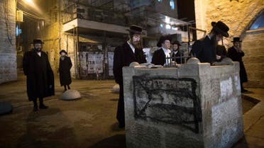 Anti-Zionist Ultra-Orthodox Jewish men pray to protest against the military service on December 11, 2015 in Jerusalem's ultra-Orthodox Mea Shearim neighbourhood