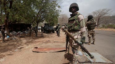 In this file photo taken Wednesday, April 8, 2015, Nigerian soldiers man a checkpoint in Gwoza, Nigeria, a town newly liberated from Boko Haram. (AP)