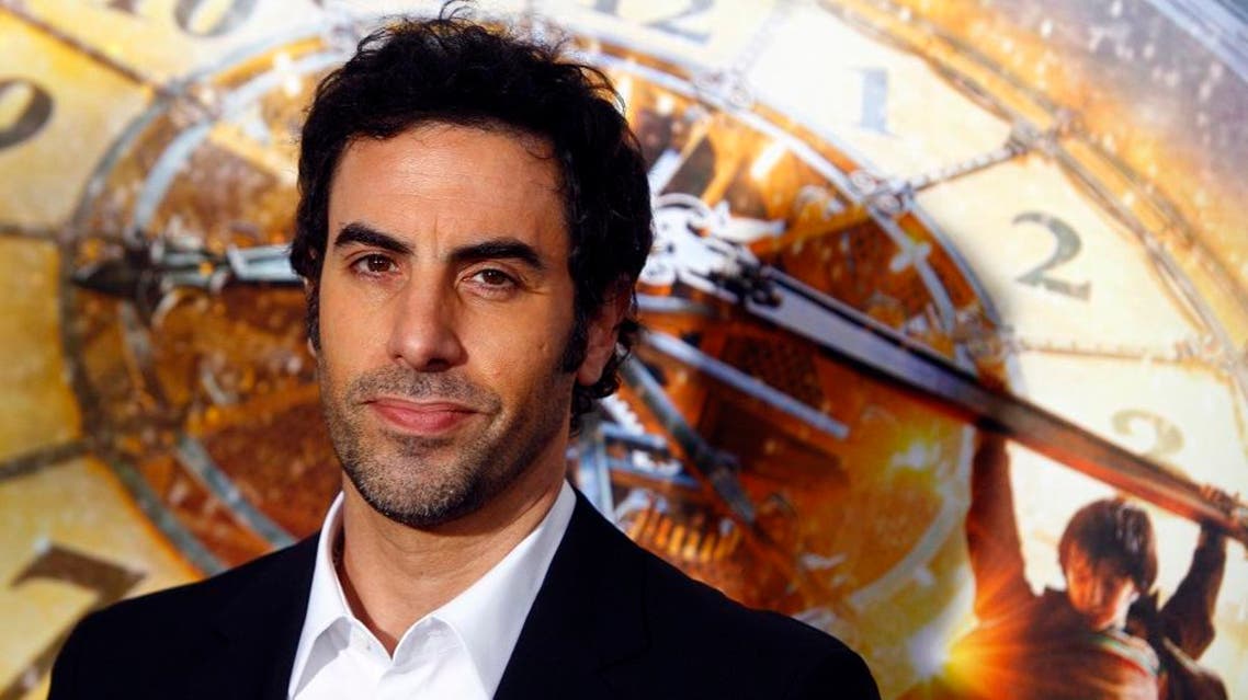The ‘Borat’ star and actress wife Isla Fisher are giving $500,000 to Save the Children to pay for measles vaccinations for children in northern Syria | Reuters