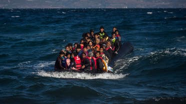 Afghan migrants on an overcrowded inflatable boat approach the Greek island of Lesbos in bad weather after crossing the Aegean see from Turkey, Wednesday, Oct. 28, 2015.