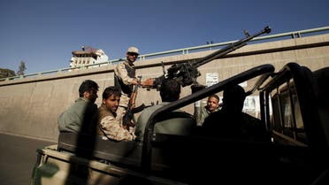 Houthi militants ride on the back of a patrol truck. (File photo: Reuters)
