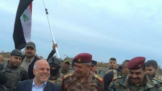 Iraq’s Abadi plants flag in Ramadi to mark ISIS defeat