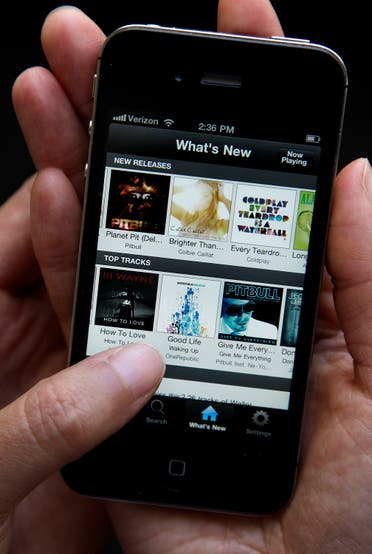 An Associated Press reporter demonstrates Spotify during a product review in San Francisco. (AP)